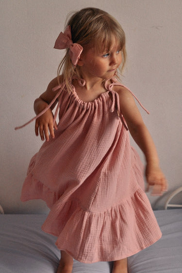 Sustainable girl's dress from lightweight, breathable organic muslin (GOTS) in dusty pink color. Handcrafted with love, made with no nasties, and allergy free. Mini Me dresses for Mommy and daughter matching are available. MiliMilu offers sustainable fashion for kids and women from organic and eco friendly materials.