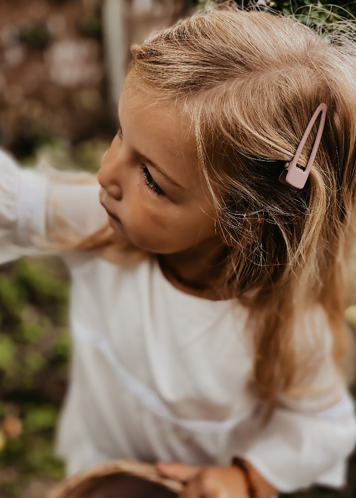 Girls wearing burlwood matte hair clips - strong grip sustainable accessories by Grech & Co