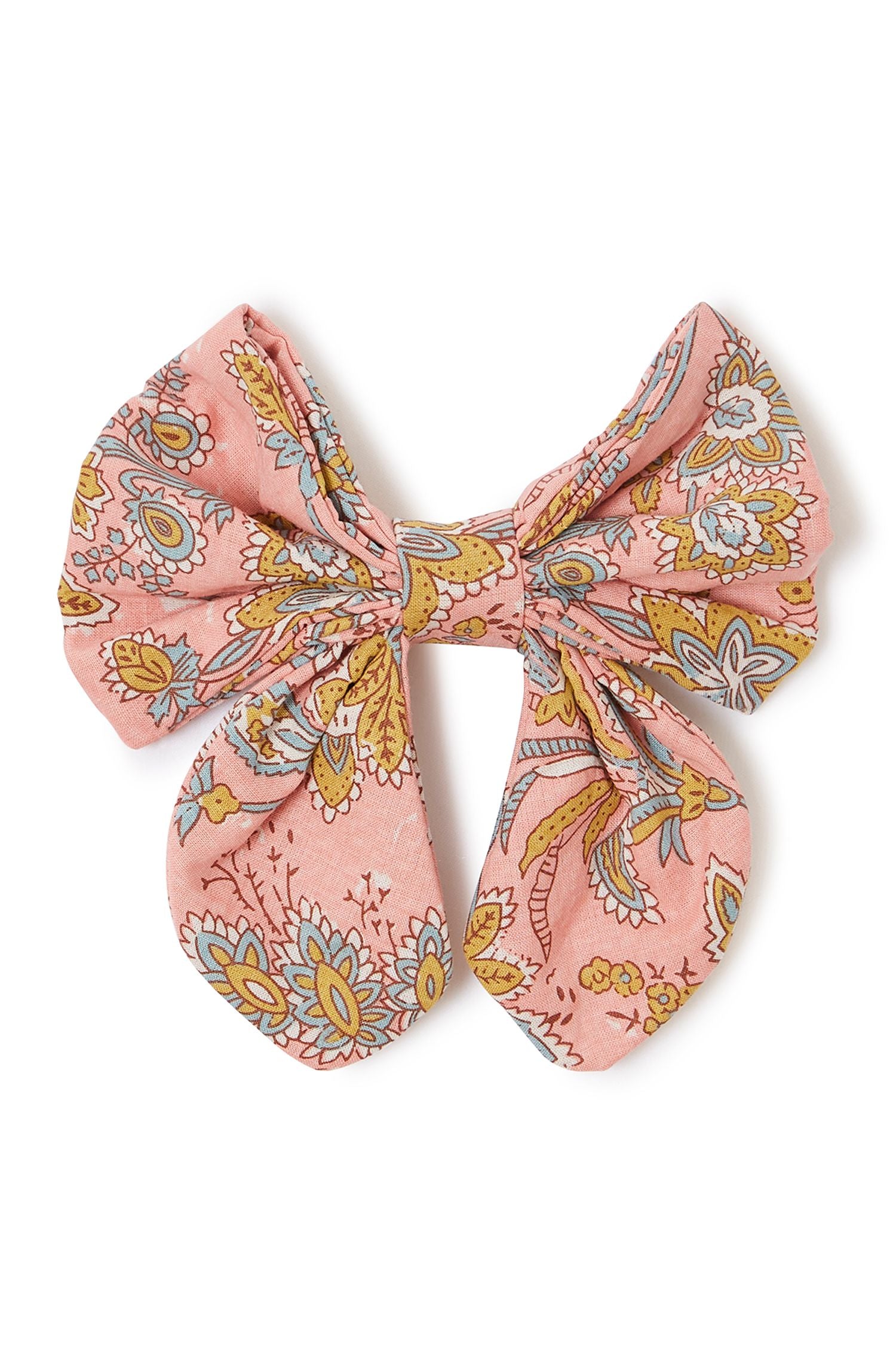 TGirl hair clip with pink riviera print is made from 100% organic cotton in a raspberry flower print by Louise Misha. Shop sustainable hair clips at MiliMilu.