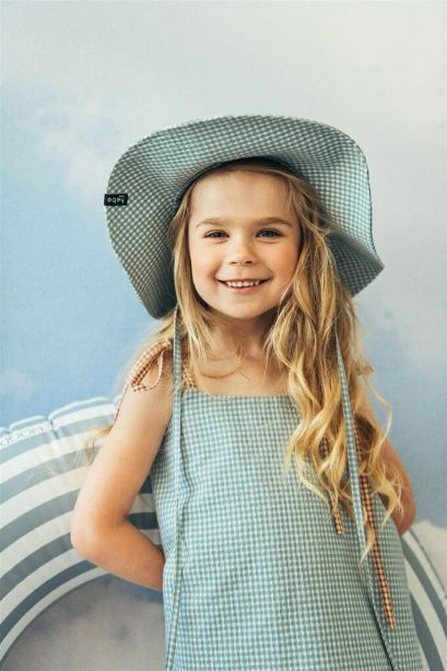 The light Mint Checkered summer hat for kids with straps. Mint kid's hat is made with lightweight and breathable organic cotton (GOTS) in green-blue checkered.