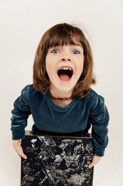 Close up detail of blue velvet kids joggers texture and quality, premium organic cotton fabric