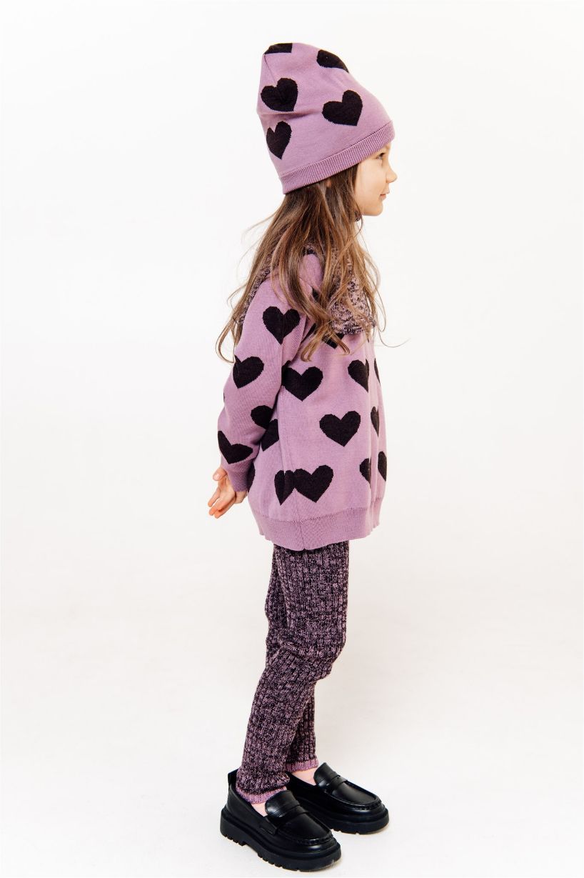 Shop soft and breathable merino wool girl hat in dark pink colour with hearts. Soft and gentle to the skin and no iching feeling kids hat for winter.