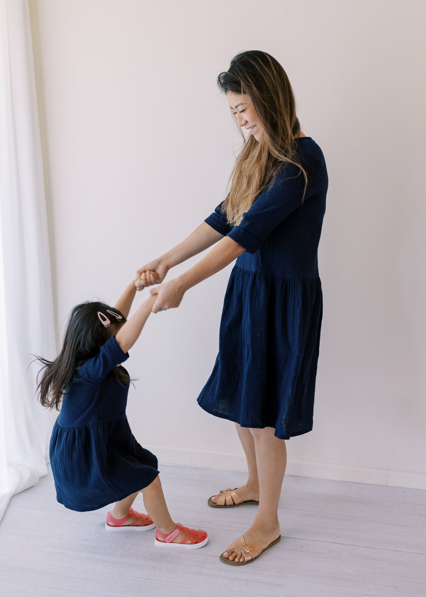 Beautifully handcraft our Back to Nature navy girls dress with 3/4 sleeves for cooler weather from organic cotton to bring you closer to nature with the freedom it gives you. This product is made of 100% organic cotton (GOTS).  This sustainable girls' dress is comfortable and soft. Mommy and Me styles are available.