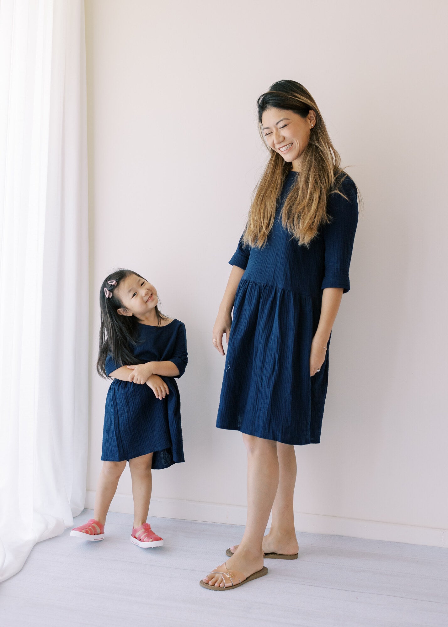 Artisans beautifully handcraft women's dresses in navy colour from organic muslin with sleeves. Mini-me dresses are available on Mommy and daughters days out!