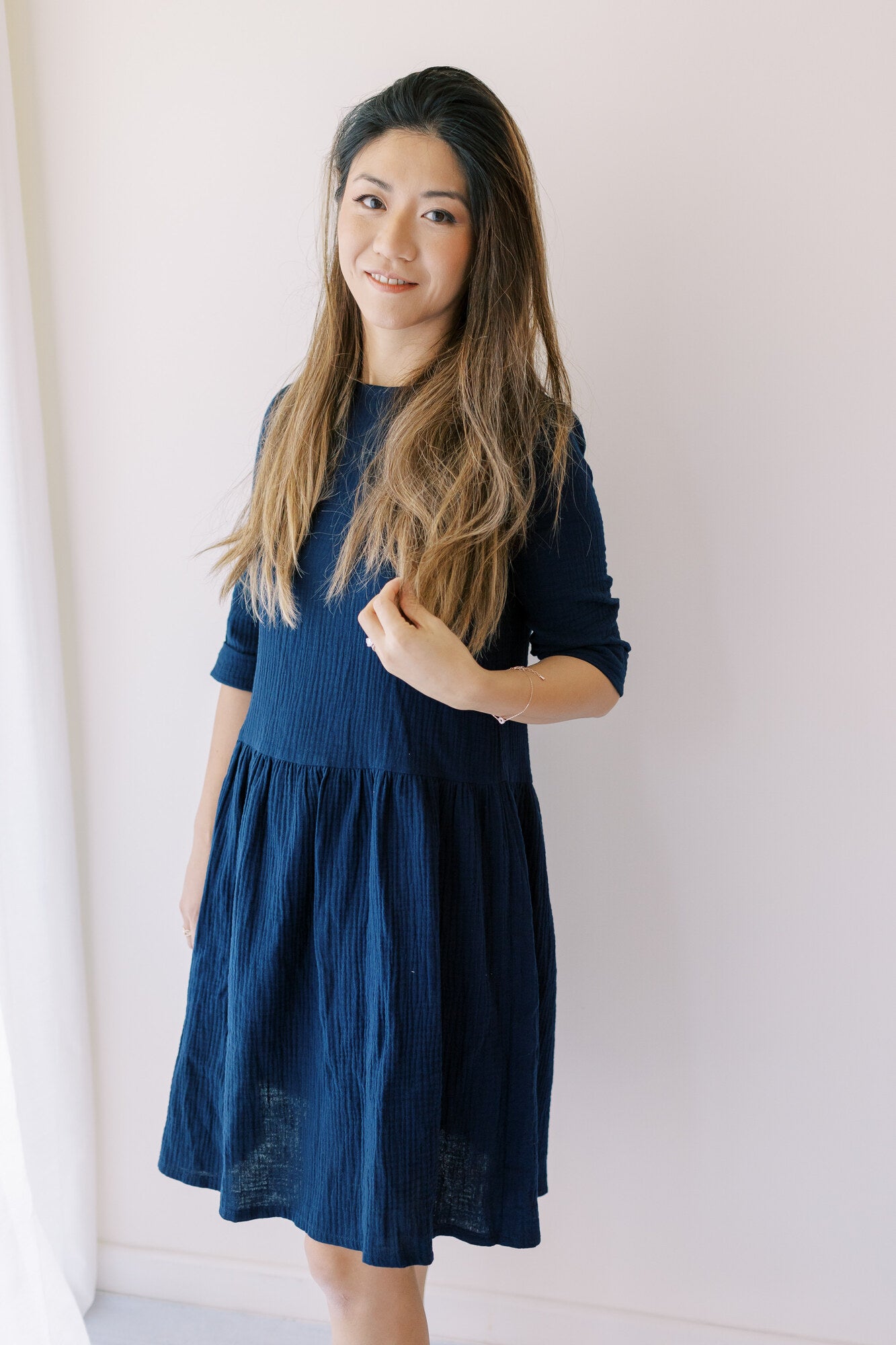 Artisans beautifully handcraft women's dresses in navy colour from organic muslin with sleeves. Mini-me dresses are available on Mommy and daughters days out!