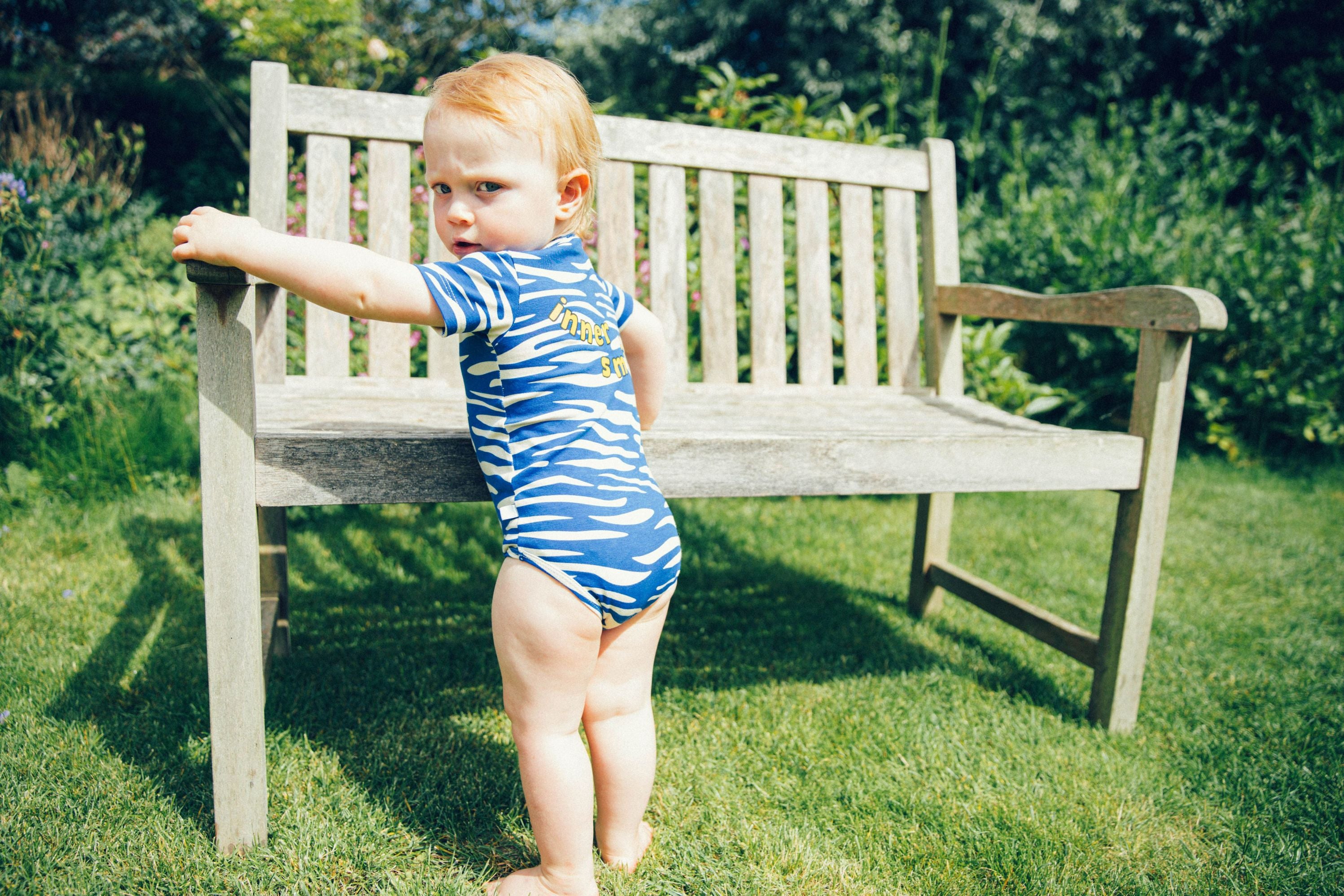 The organic cotton baby body is comfortable and soft for everyday wear with blue stipes and short sleeves, also suitable for sensitive and eczema prone skin.