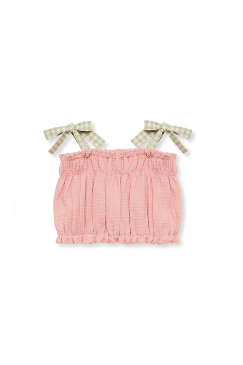 The organic cotton girl cropped in pink is adjustable and will grow with you. The organic cotton girl cropped top is breathable and made with organic muslin.