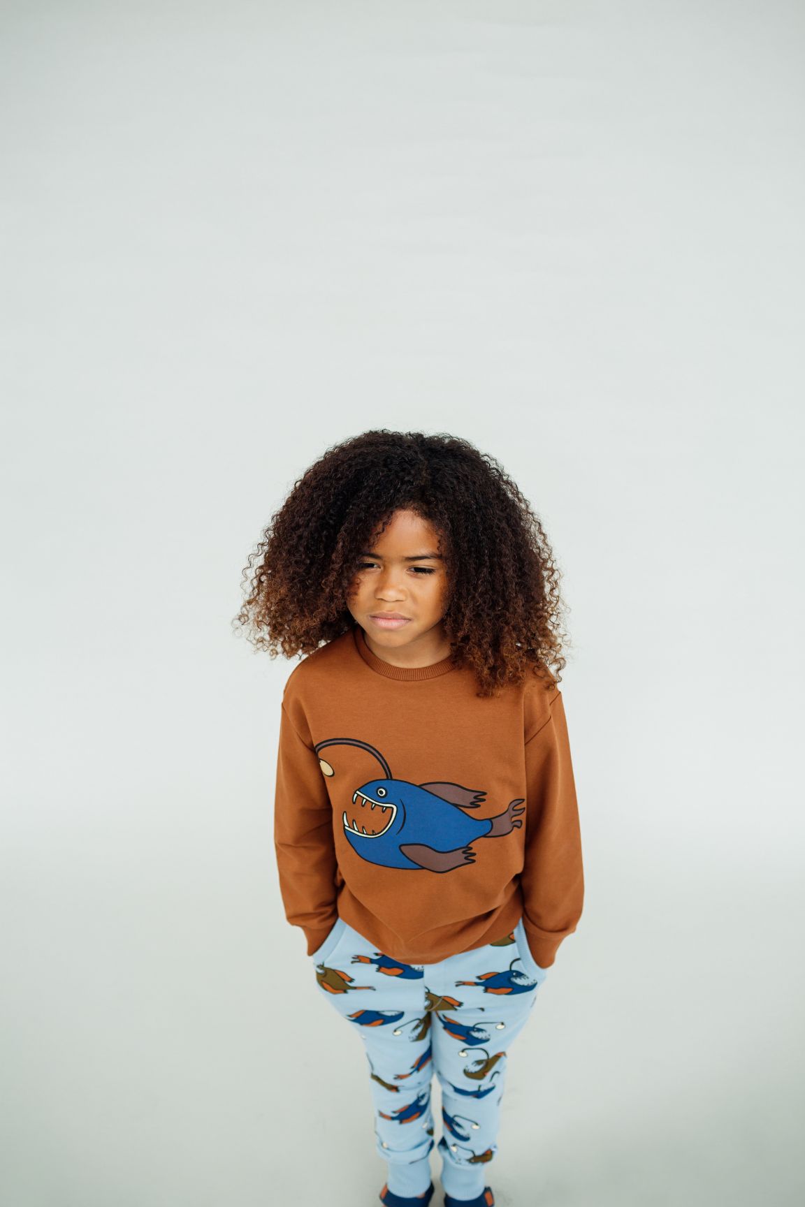 Child wearing anglerfish kids joggers by CarlijnQ, organic cotton By the Sea collection