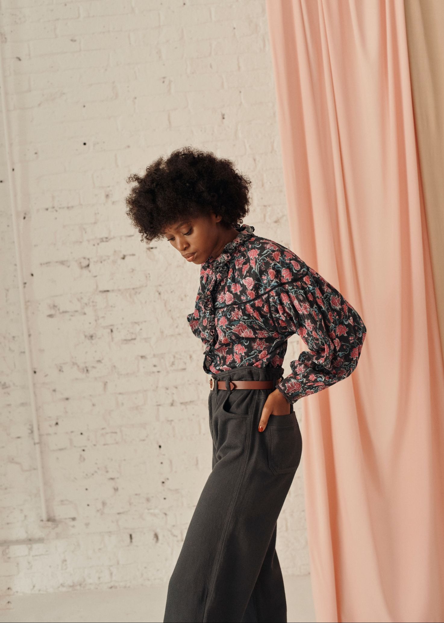 Detail of gathered cuffs and lace on Louise Misha organic cotton blouse — charcoal wildflowers print