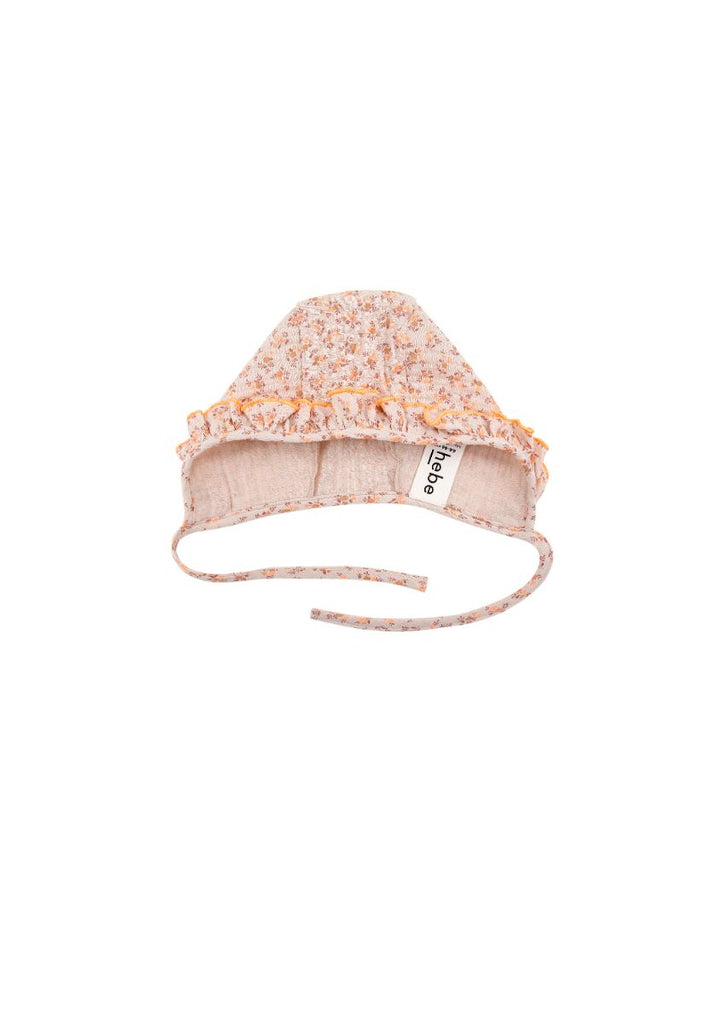 The breathable organic muslin baby girl's hat with a small floral print and ruffle is the most adorable hat for summer and also for sun protection. The soft and breathable muslin baby girl's sun hat will ensure she is the cutest baby. MiliMilu offers sustainable baby clothing from organic cotton in Hong Kong.