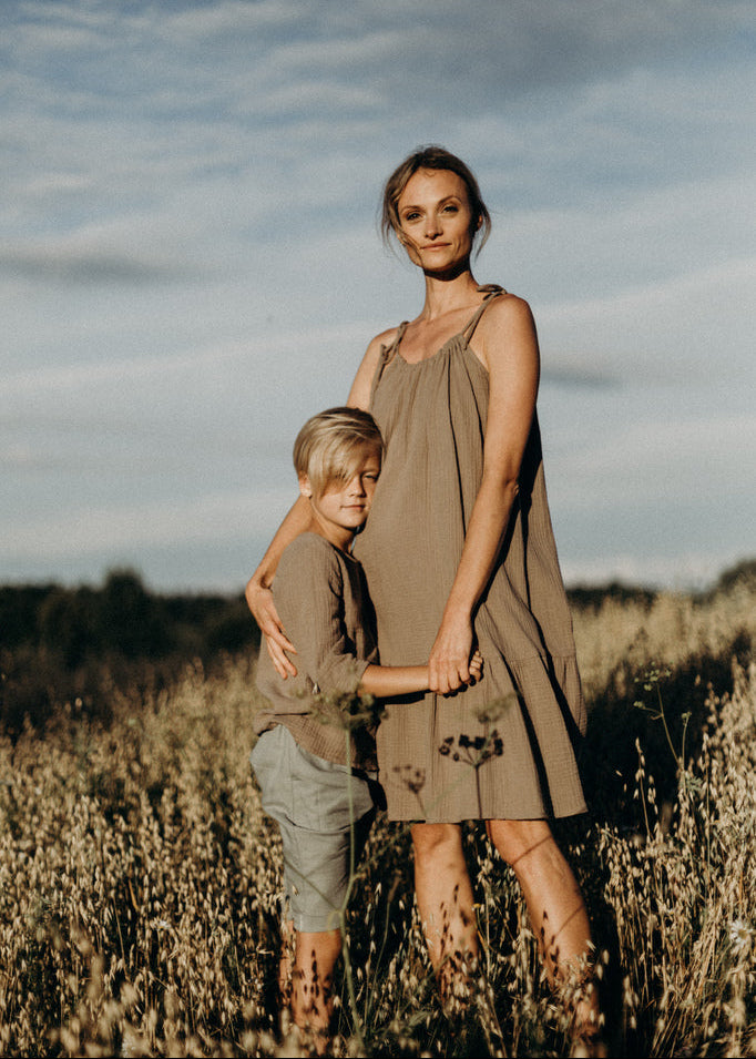 Organic muslin boys shirt in sand colour - front view showing breathable lightweight fabric and relaxed fit