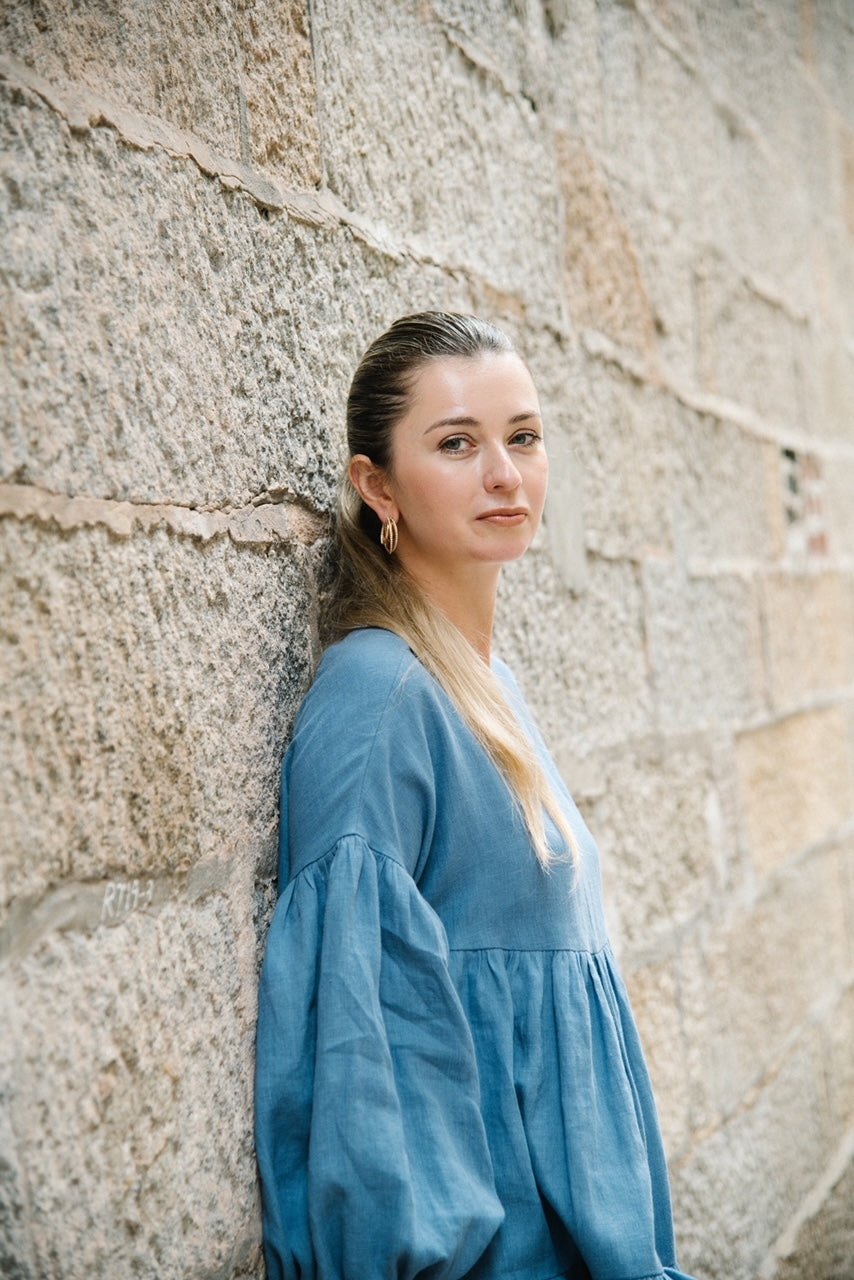 Slow fashion women's linen dress in french blue color with long voluminous sleeves made from pure linen. Timeless women's dress for capsule wardrobe.