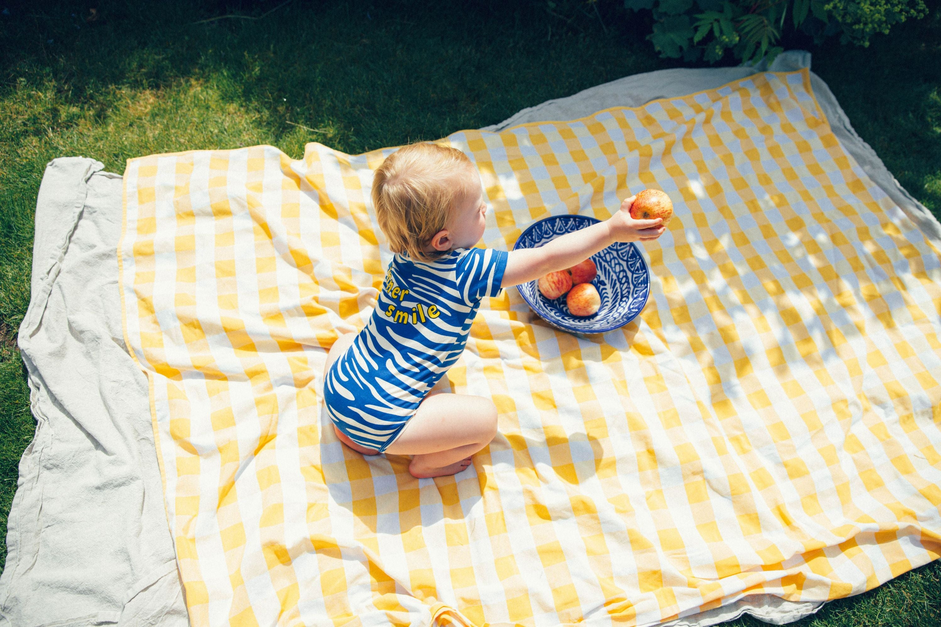 The organic cotton baby body is comfortable and soft for everyday wear with blue stipes and short sleeves, also suitable for sensitive and eczema prone skin.