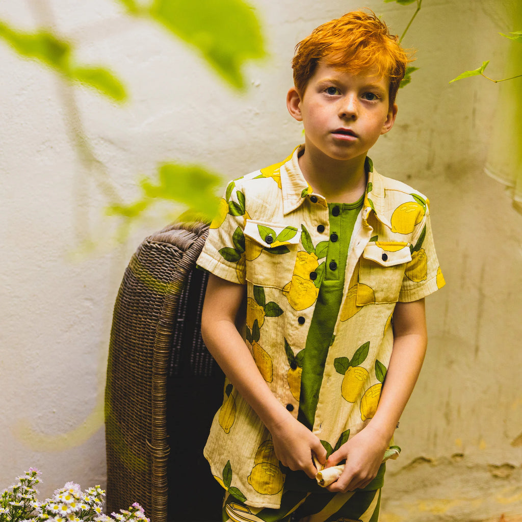 The breathable lemon shirt is made with lightweight organic muslin. The Lemon shirt is made with lightweight and breathable organic muslin cotton by CarlijnQ. The best and most stylish shirt for hot and humid weather. The most breathable kids shirt for hot and humid weather. Sustainable and practical kids clothing.