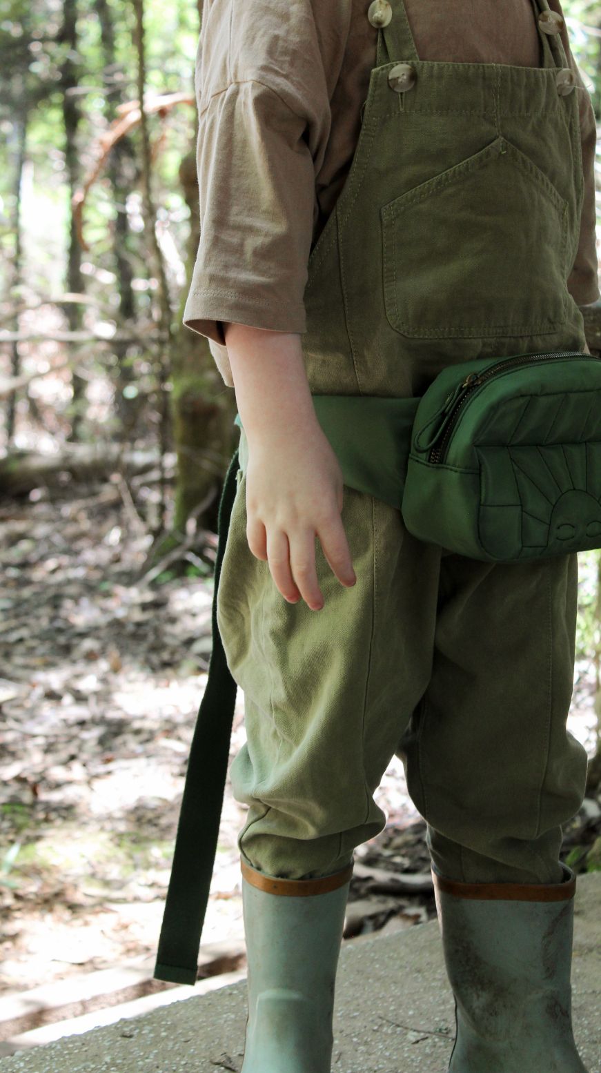 A sustainable crossbody/waist bag or fanny pack for women and kids in green colour from Grech&Co. Made from Eco-Friendly materials and is waterproof online.