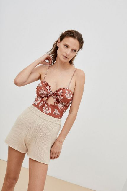 Sienna women swimsuit is made from recycled fabric with sun protection in floral print in dark red. One piece women swimsuit is eco friendly with feminine touch
