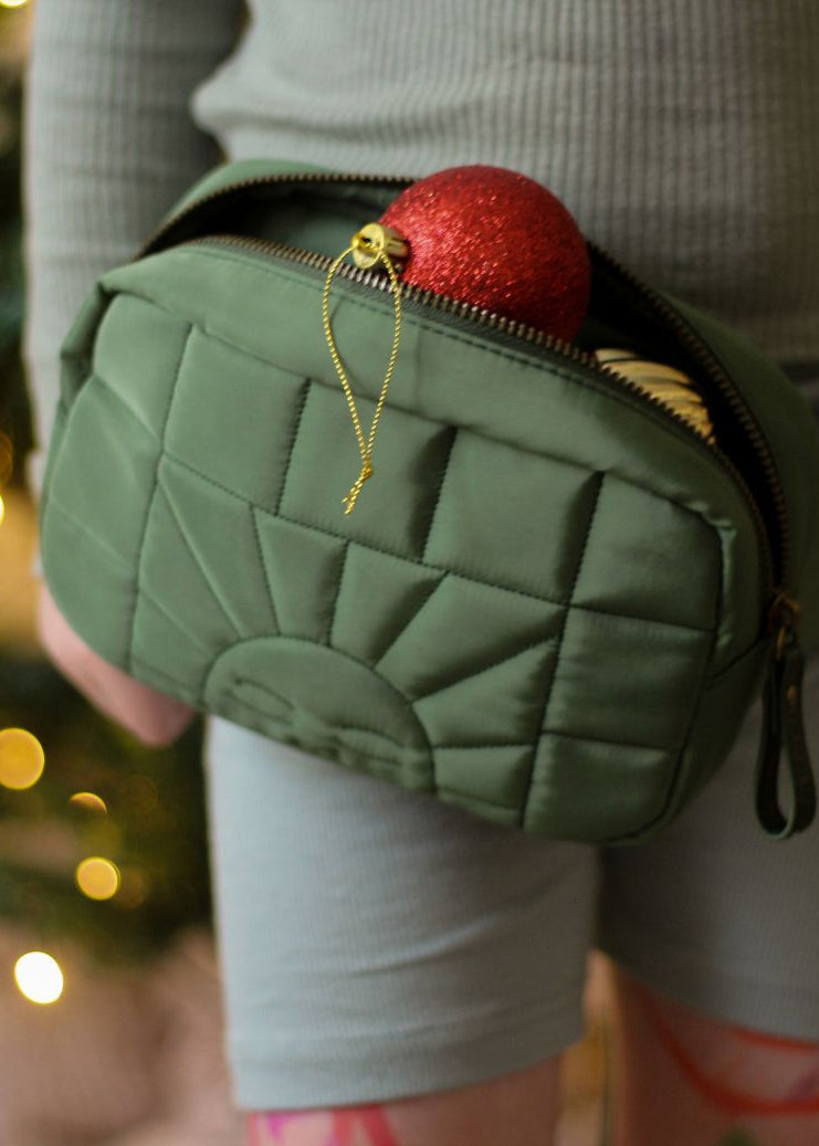 Weatherproof green waist bag with bronze hardware, recycled materials by Grech & Co