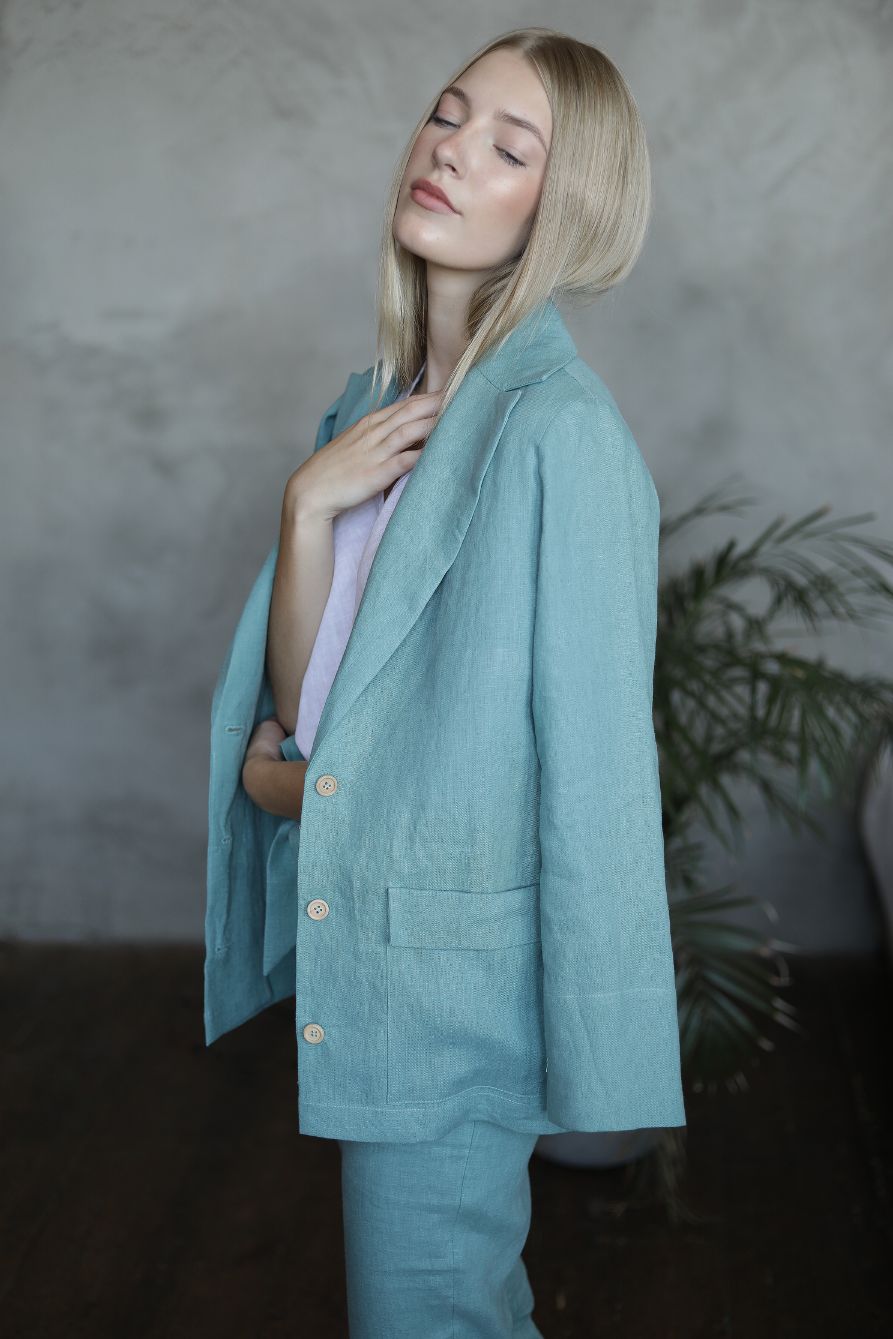 The womens blazer is a loose style jacket in Sea blue, handcrafted from the highest quality European linen. Shop sustainable, slow-fashion womens cothing.