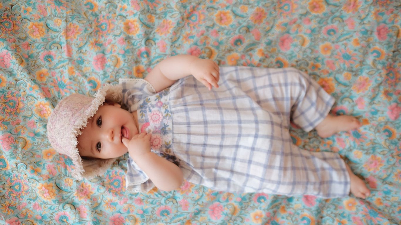 Newborn baby wearing soft organic cotton romper