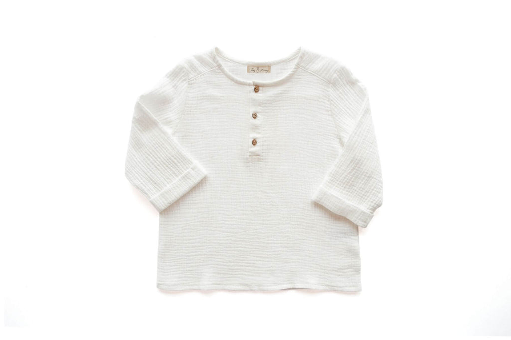 Looking for comfortable and lightweight clothing for your kids to wear during hot and humid weather? MiliMilu's handmade kid's muslin shirt in white is made from organic cotton and is perfect for summer. MiliMilu specializes in eco-friendly and organic kids and baby clothing in Hong Kong and Singapore.