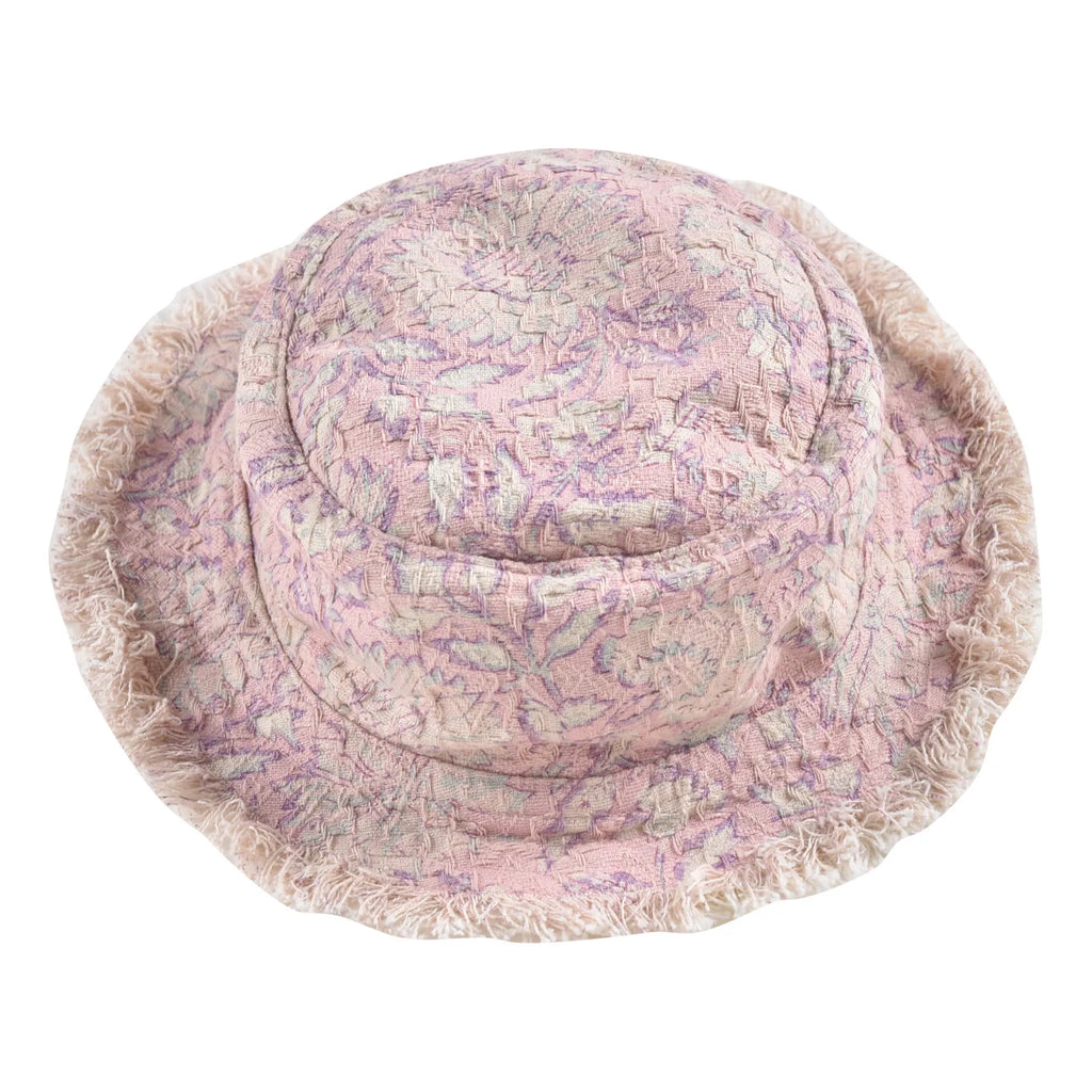 Our kid's bucket sun hat, which is not only lightweight and stylish but also comes in a beautiful print that your child will love. On one side, you have a charming pink daisy garden print, and on the other side, an off-white colour with a fringed edge. Designed by Louise Misha. Mini Me matching is available.