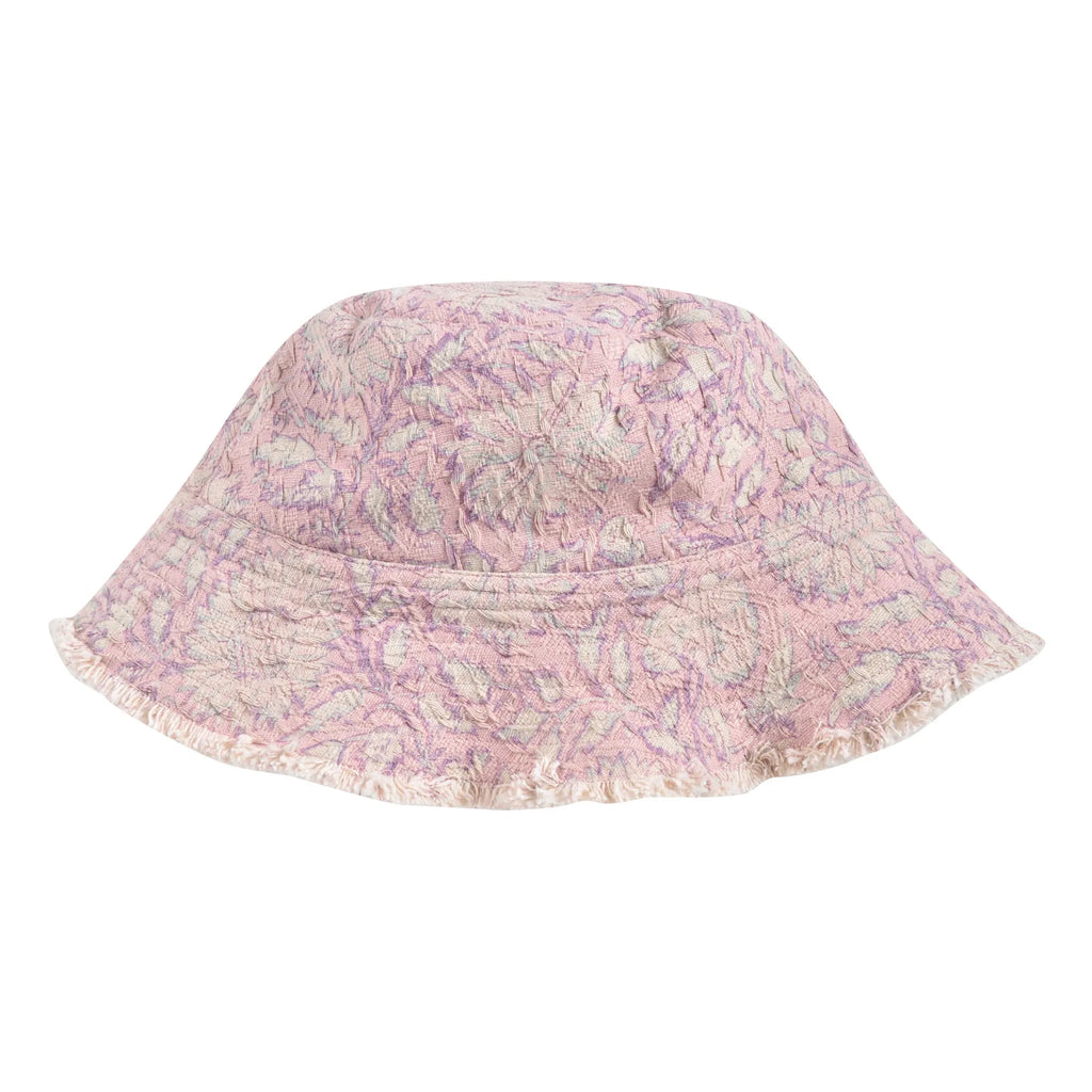 Our kid's bucket sun hat, which is not only lightweight and stylish but also comes in a beautiful print that your child will love. On one side, you have a charming pink daisy garden print, and on the other side, an off-white colour with a fringed edge. Designed by Louise Misha. Mini Me matching is available.