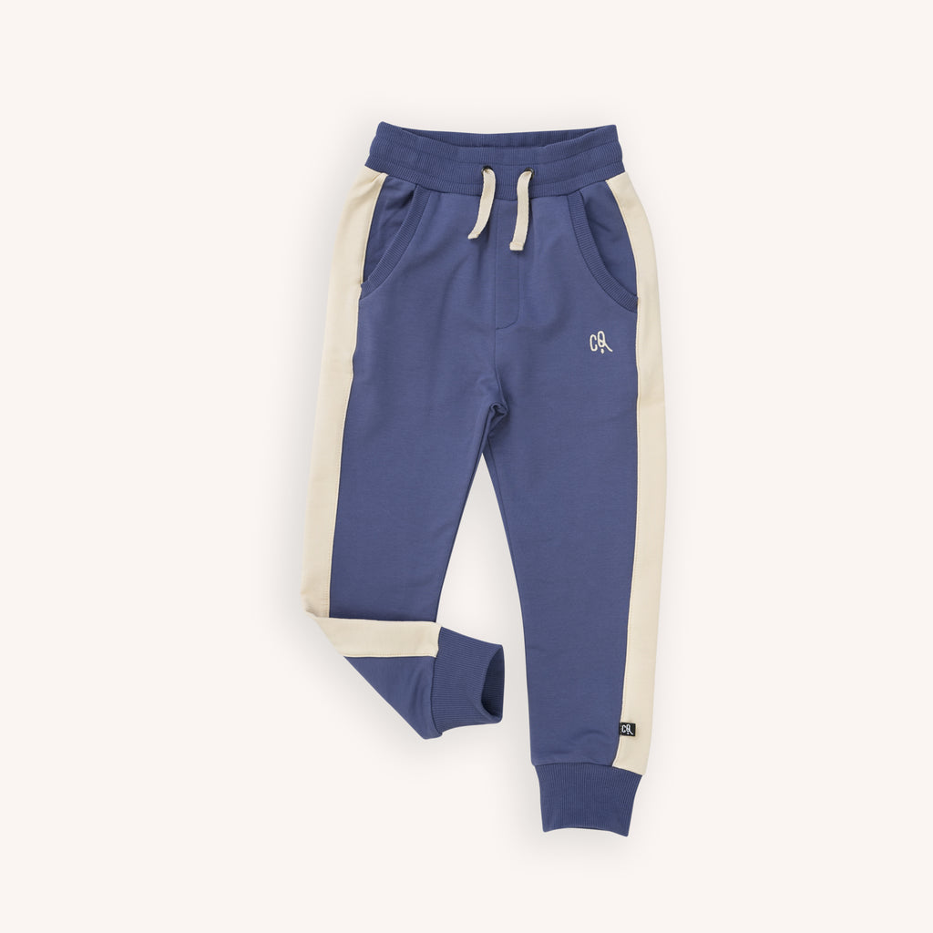Shop organic cotton kids'  and boys' joggers online in  Hong Kong and Singapore at Milimilu by CarlijnQ.  These boys in blue joggers have two side pockets. MilMilu offers practical and stylish kids' clothing online that is also made with organic materials and is very comfortable for babies, kids and tweens to wear. 