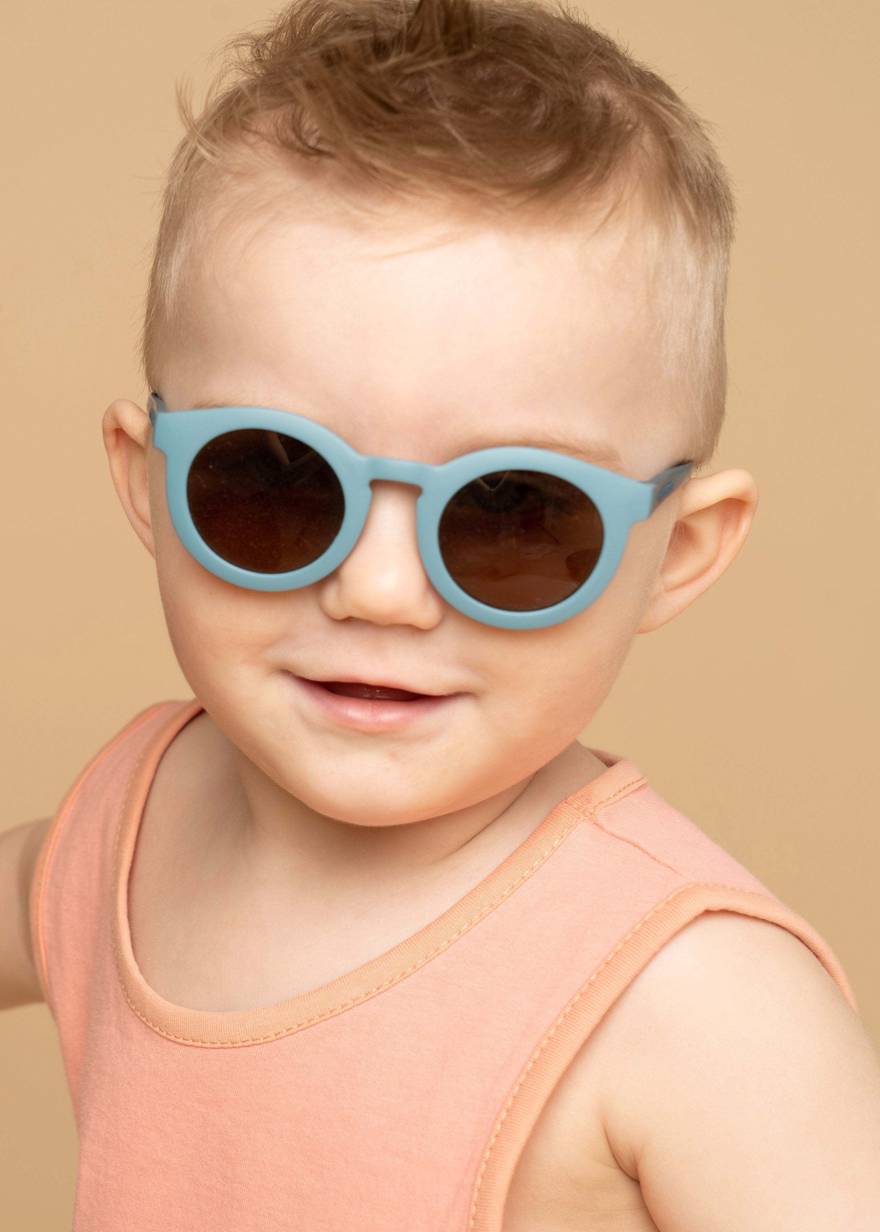 Sustainable baby sunglasses in blue in an eco-friendly/non-toxic break-resistant material with polarised lenses & UV400 protection. Family matching sunglasses.