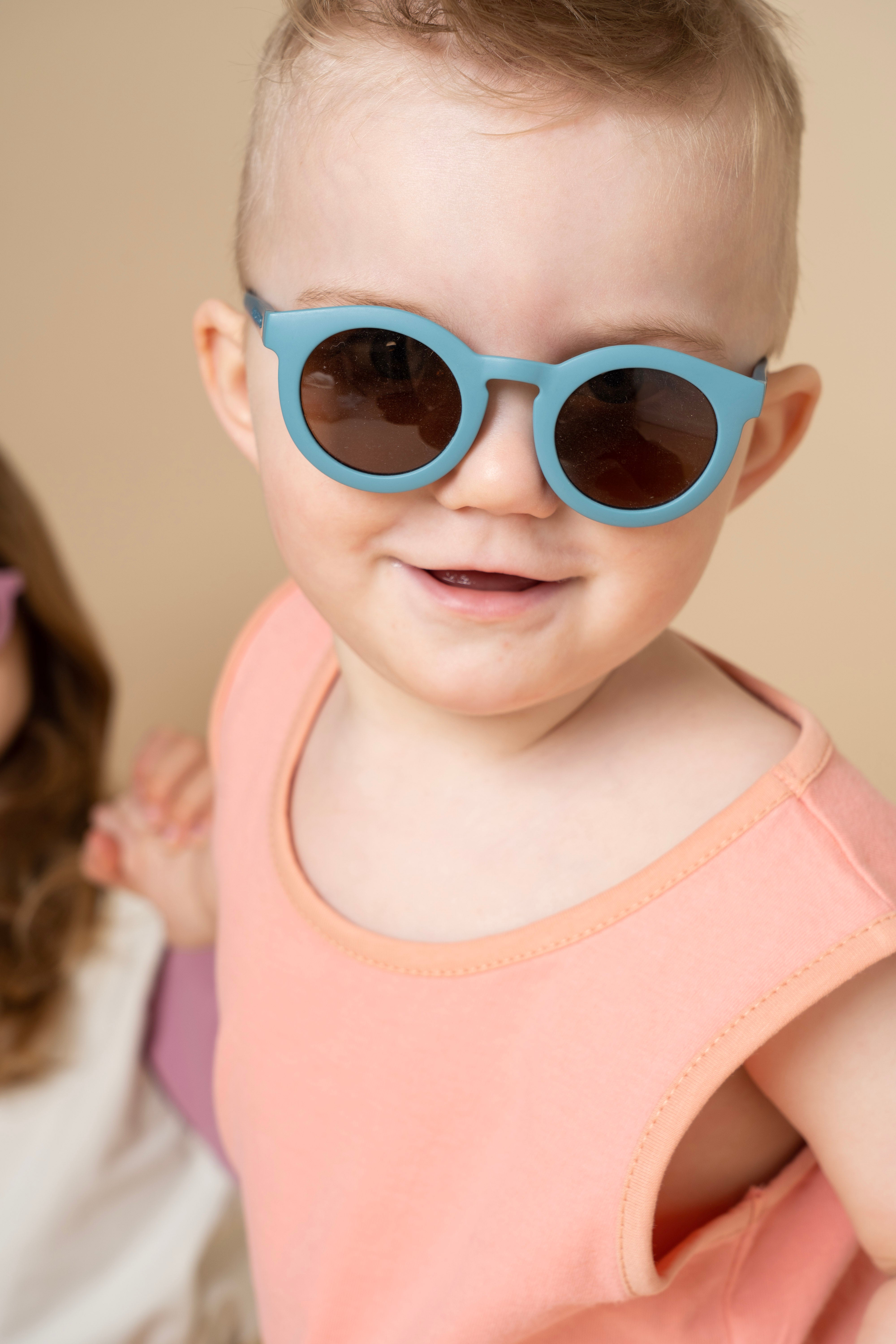 Sustainable baby sunglasses in blue in an eco-friendly/non-toxic break-resistant material with polarised lenses & UV400 protection. Family matching sunglasses.