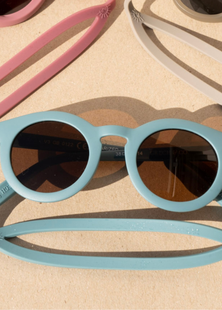 Sustainable sunglasses in blue are made with eco-friendly/non-toxic break-resistant material with polarised lenses & UV400. Family matching sunglasses available
