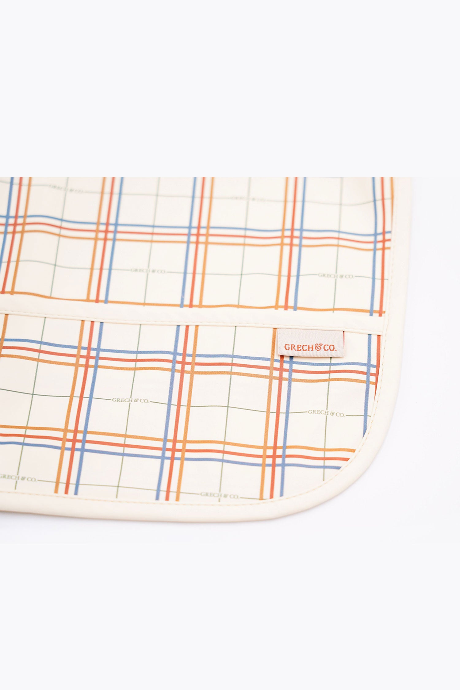 Sustainable baby bib in plaid pattern is water-resistant recycled Oeko tex material. Stylish and practical baby bib for being on the go. Best baby accesories