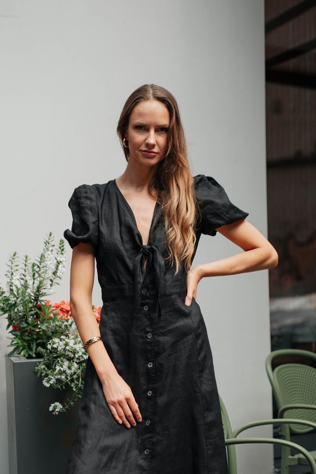 Black linen dress from MiliMilu showing brand label and quality details.