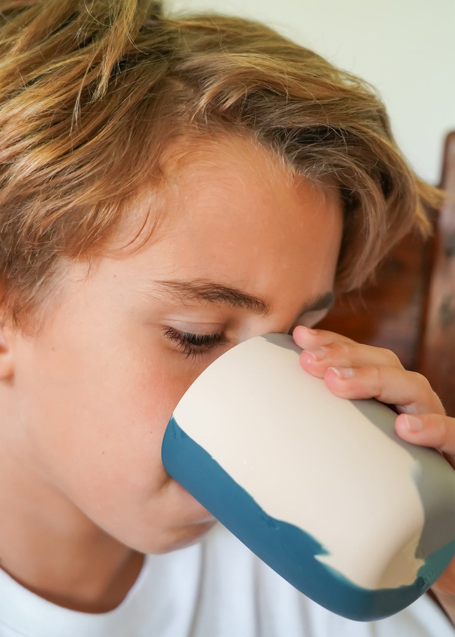Young child drinking from Grech & Co blue and stone silicone toddler cup — easy-grip BPA-free kids cup at Milimilu HK SG AU UK