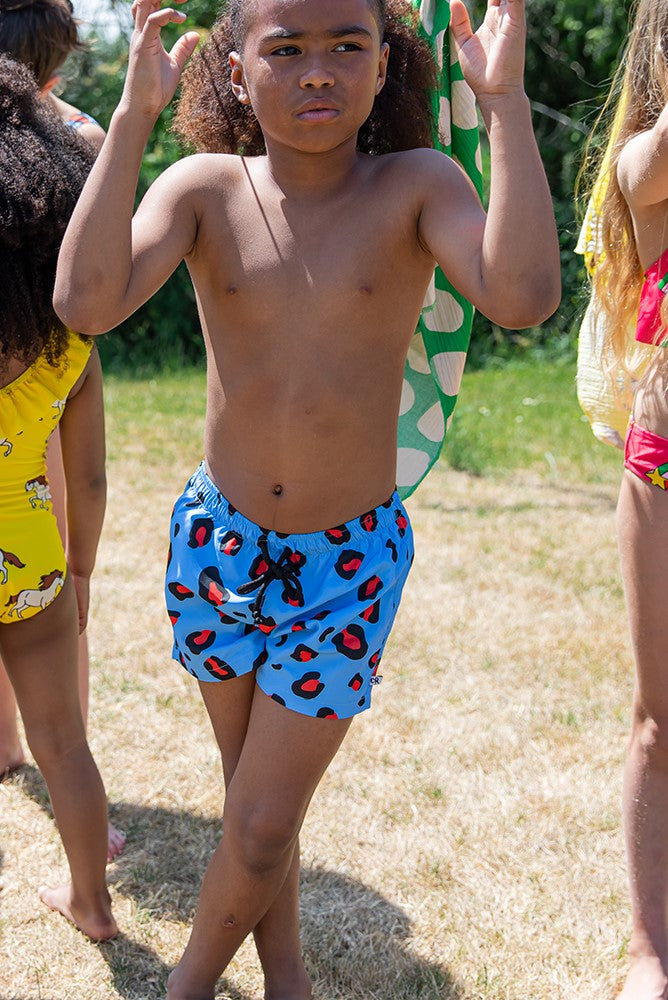 Shop leopard print swim shorts for adventurous boys online at MiliMilu. These vibrant swim trunks with blue base are crafted from 100% reprieve recycled polyester -  the best eco friendly swimwear for kids and swim shorts for boys, Make this summer extra trendy with practical kids clothing that is east to wear.