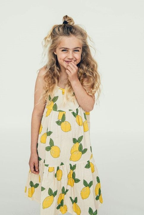 Organic muslin girls' dress with all over lemon print is stylish and will grow with you as have adjustable straps and a wide fit. The perfect girl's and teen summer dress during hot and humid weather- like summer and holidays: shop girls' summer dresses and girl's clothing online in Hong Kong and Singapore.