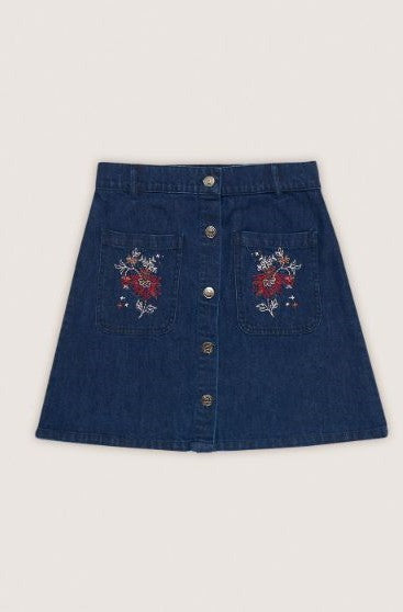 High waisted women's denim mini skirt in sustainable BCI cotton, front view showing flattering fit and styling