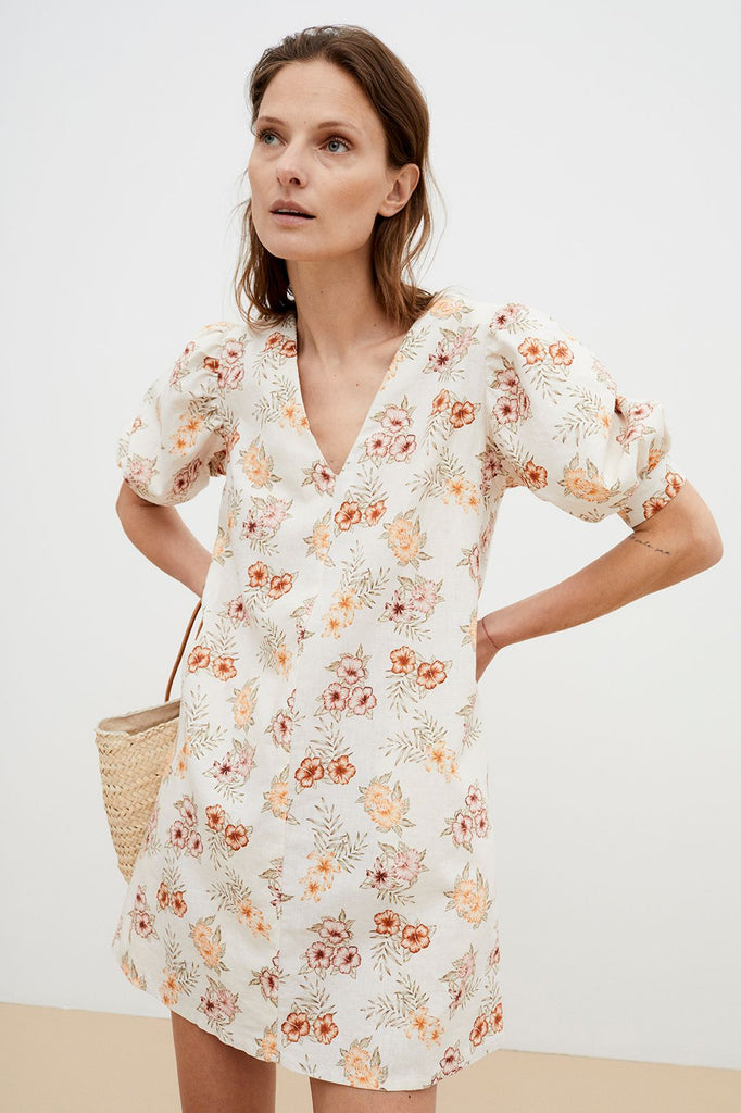 The Palermo women's linen dress is breathable and lightweight with flower print, short balloon sleeves and pockets. Made in Portugal by The New Society. Fashionable and feminine summer mini dress during summer and holidays. MiliMilu offers women's fashion and women's summer dresses online in Hong Kong and Singapore.