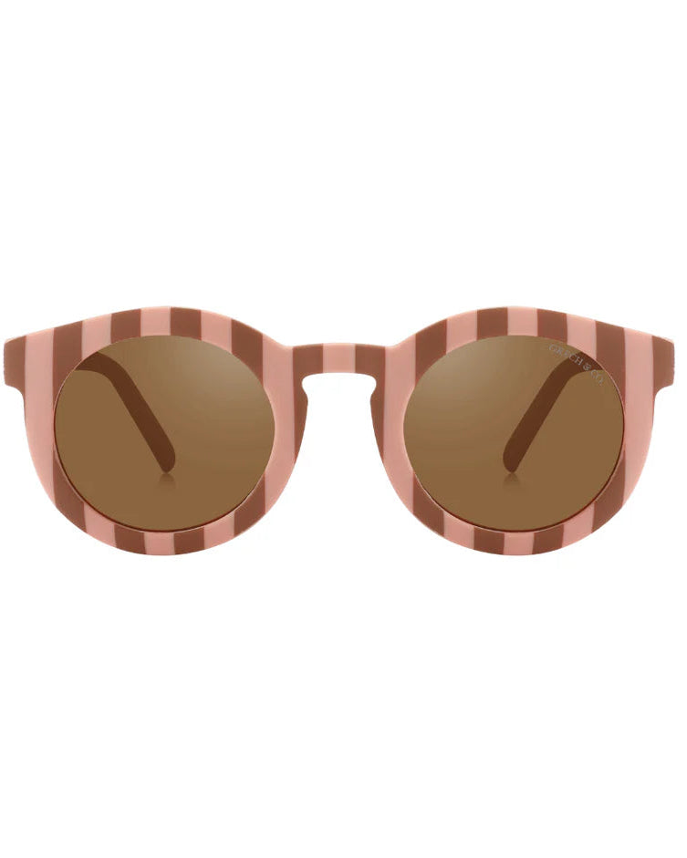 Sustainable sunglasses in pink and red for women by Grech & Co are eco-friendly with polarised lenses and UV400 protection. Mini Me styles are available.