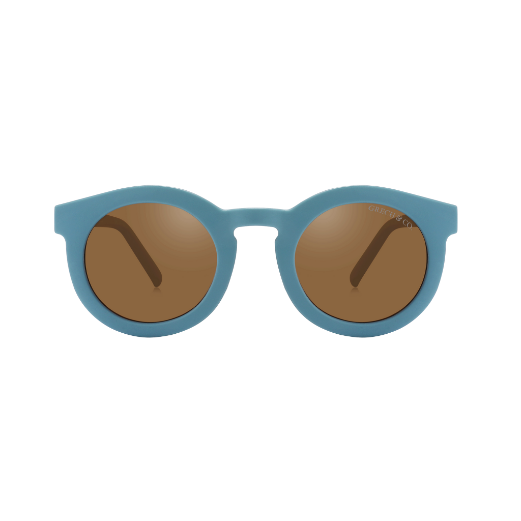 Sustainable sunglasses fir adults in blue are made with eco-friendly/non-toxic break-resistant material with UV400 protection. Mini-Me styles are available.