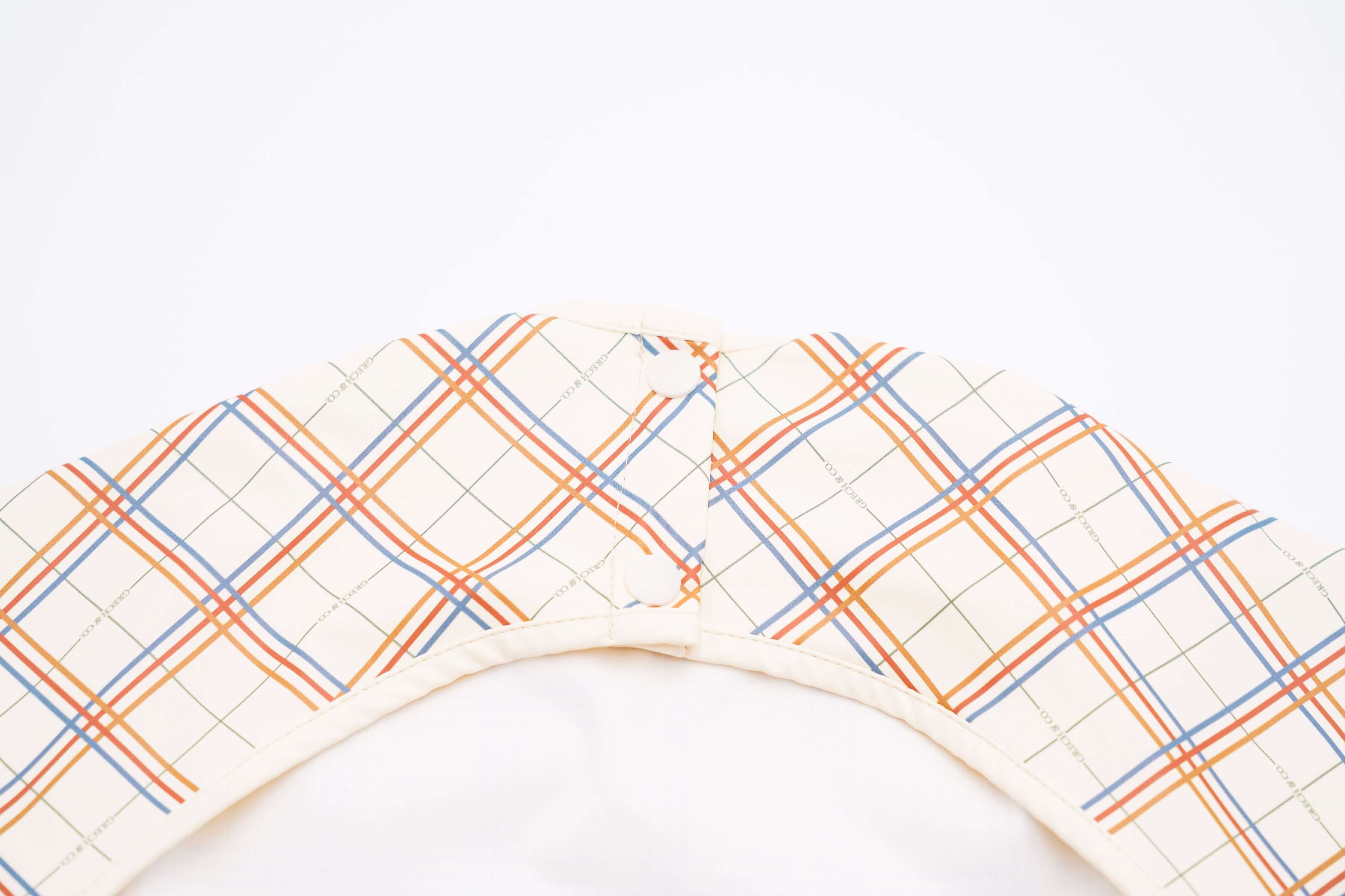 Baby bib online in Hong Kong and Singapore from eco-friendly and sustainable materials. Keep mealtimes cleaner and fun for all with the Grech & Co. easy-to-clean and store plaid baby bib, water-resistant recycled Oeko tex material. Stylish and practical baby and kids' bib for everyday use and best bib for travelling.