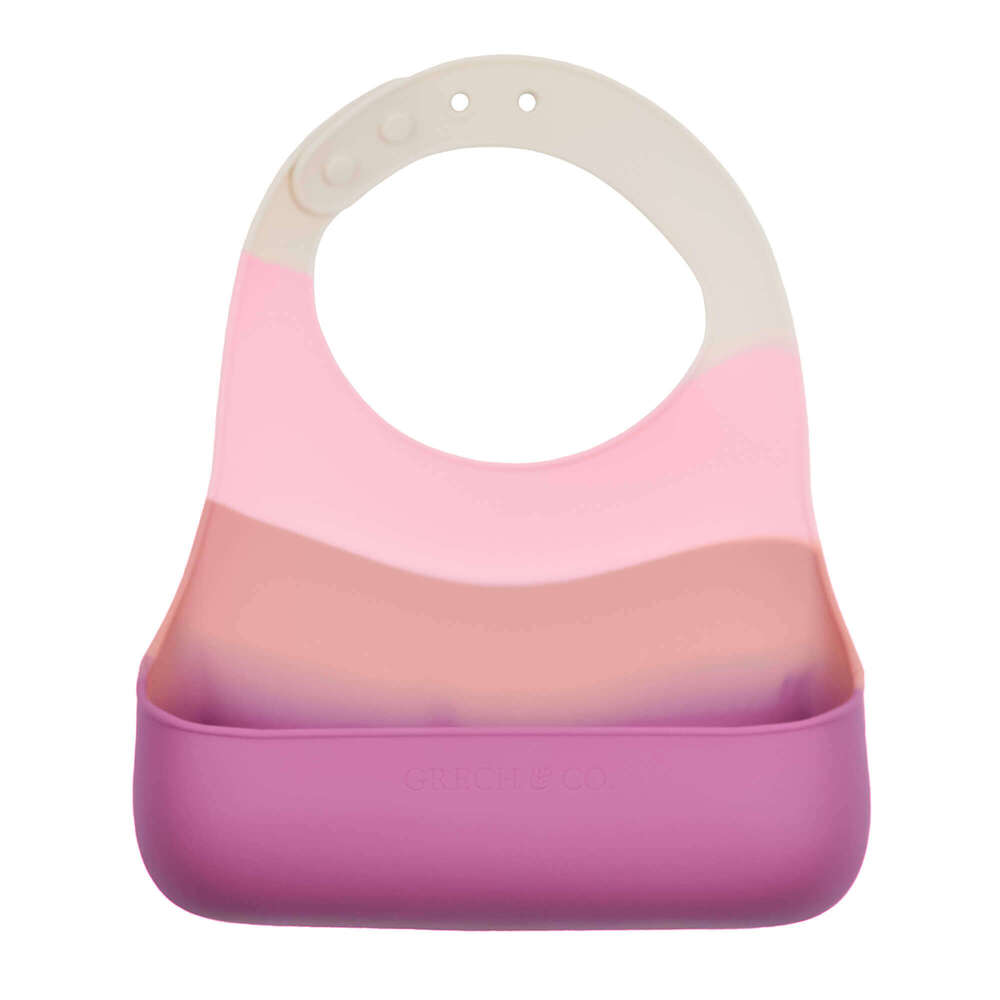 The eco-friendly silicon baby bib in bright pink colours is the most stylish and practical bib you will find online in Hong Kong and Singapore. This baby bib is hypoallergenic. The GRECH & CO. leakproof lightweight pink baby bib is also highly durable, easy to clean and dishwasher safe. Perfect baby bib for traveling.