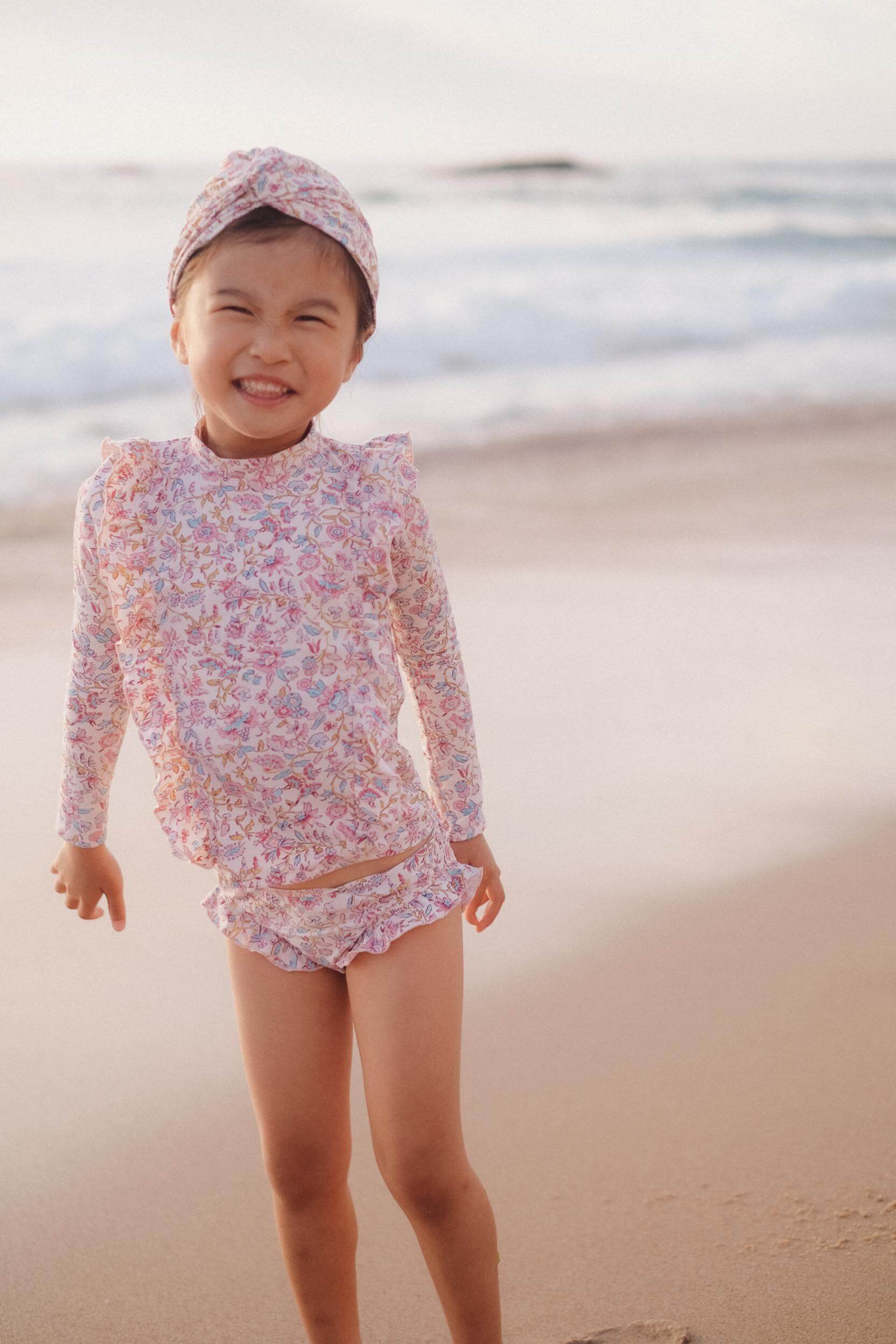 The most popular girls swim set in cream Padma mundra,  made with recycled materials  SPF& 50 sun protection by Louise Misha. Shop girl's swimwear online.