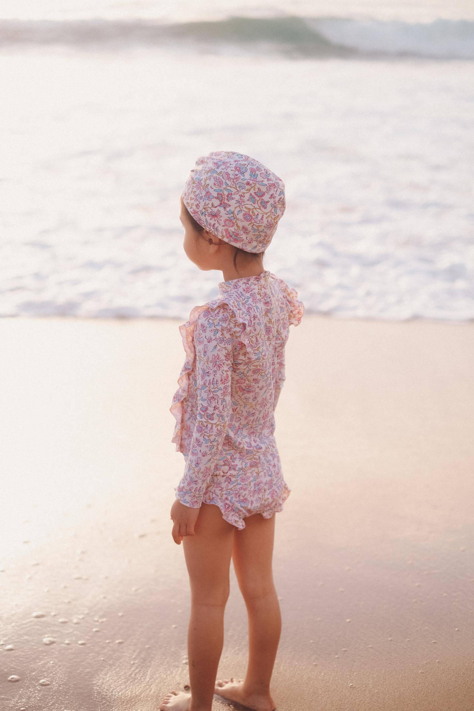 The most popular girls swim set in cream Padma mundra,  made with recycled materials  SPF& 50 sun protection by Louise Misha. Shop girl's swimwear online.