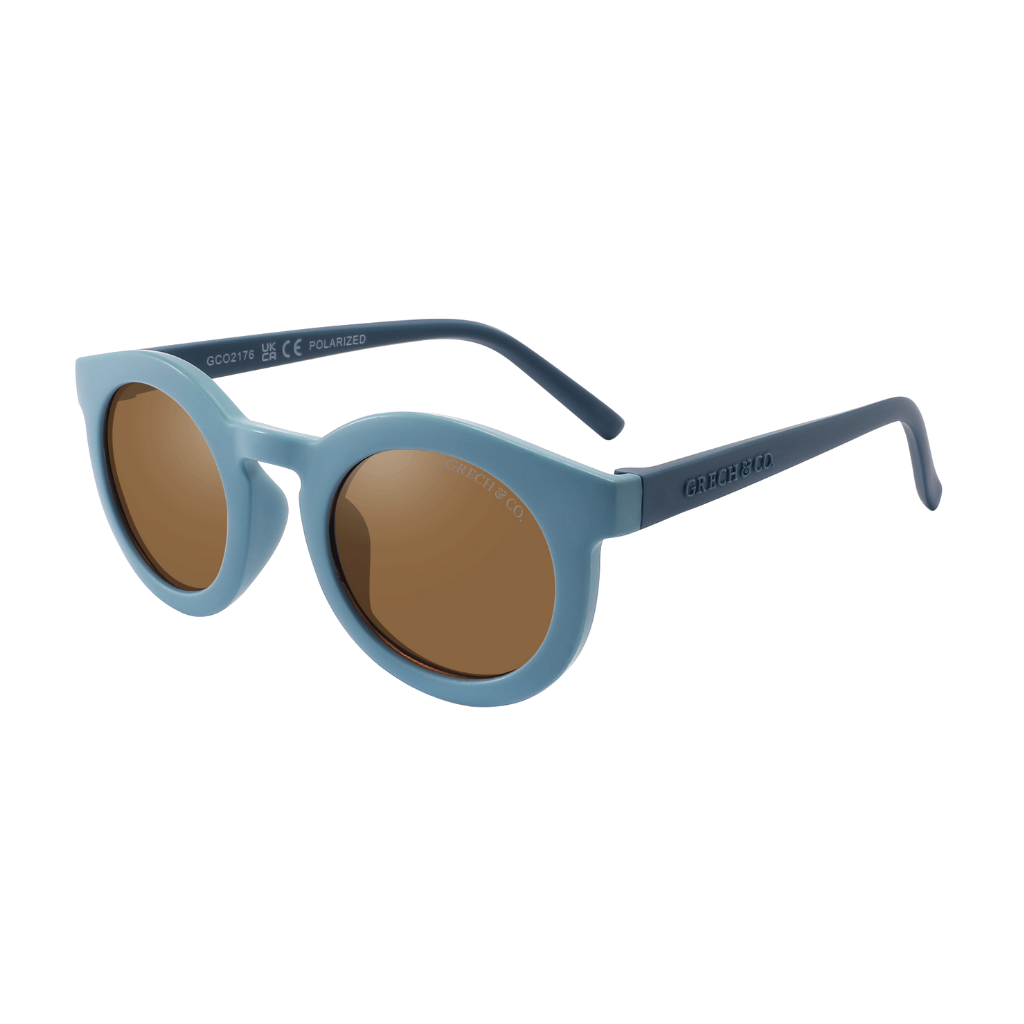 Sustainable sunglasses fir adults in blue are made with eco-friendly/non-toxic break-resistant material with UV400 protection. Mini-Me styles are available.