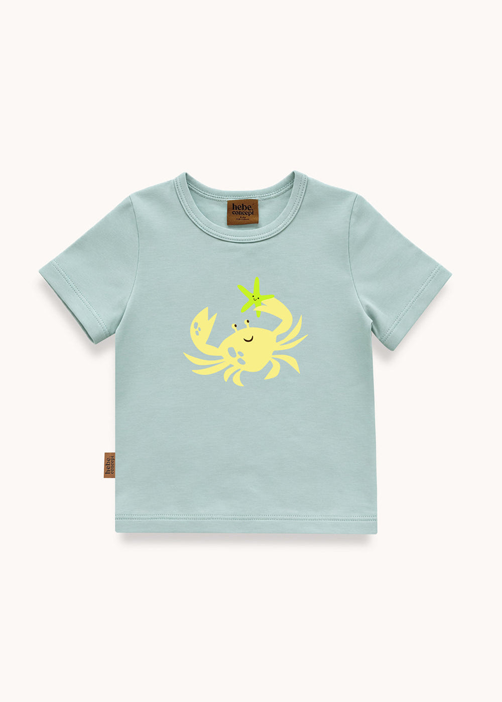 Flat lay of crab print kids T-shirt in aqua blue – 95% organic cotton, made in Latvia