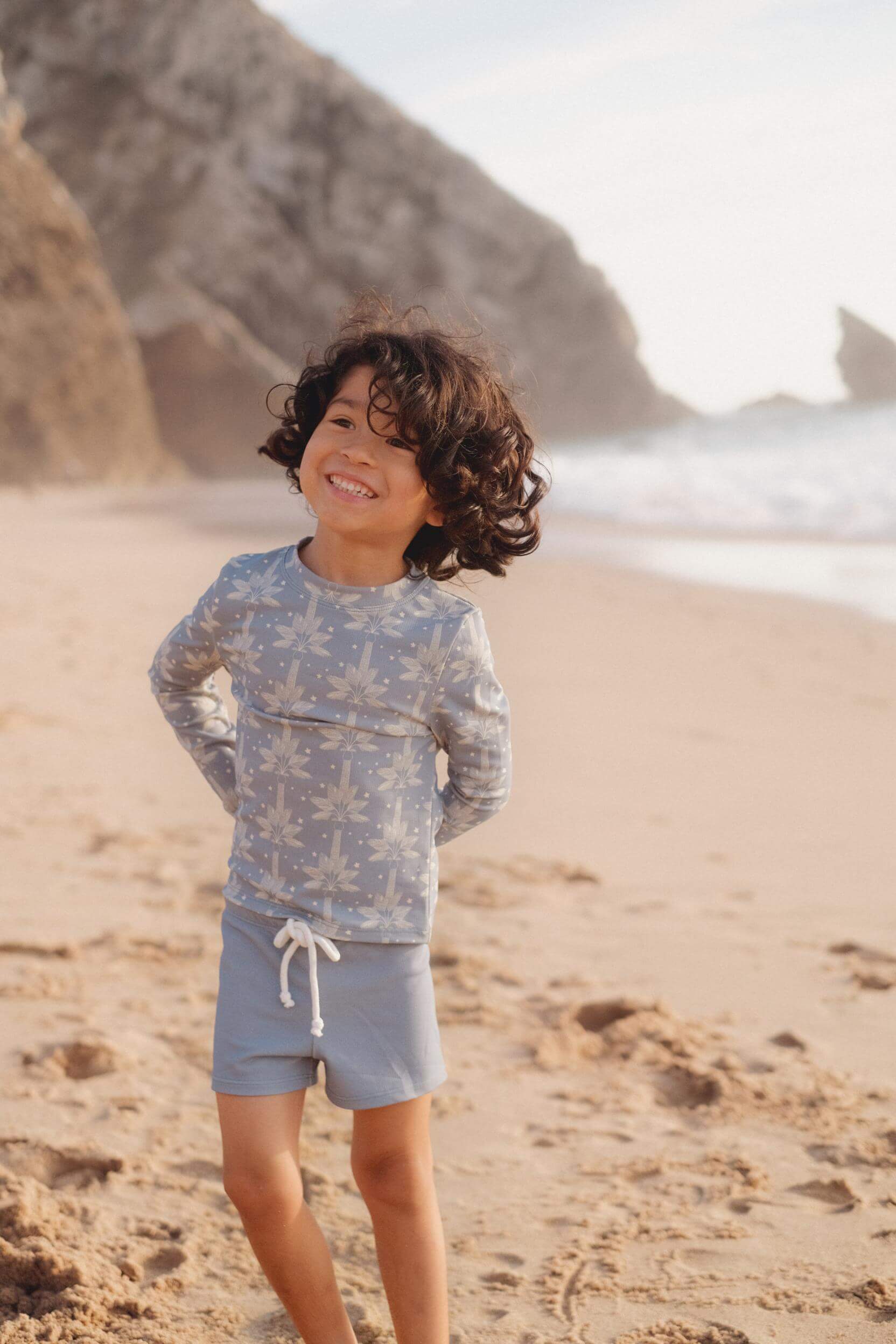 long sleeve boys by Louise Misha's blue print made from recycled materials. The SPF 50 fabric keeps the upper body safe from harmful sun rays online.