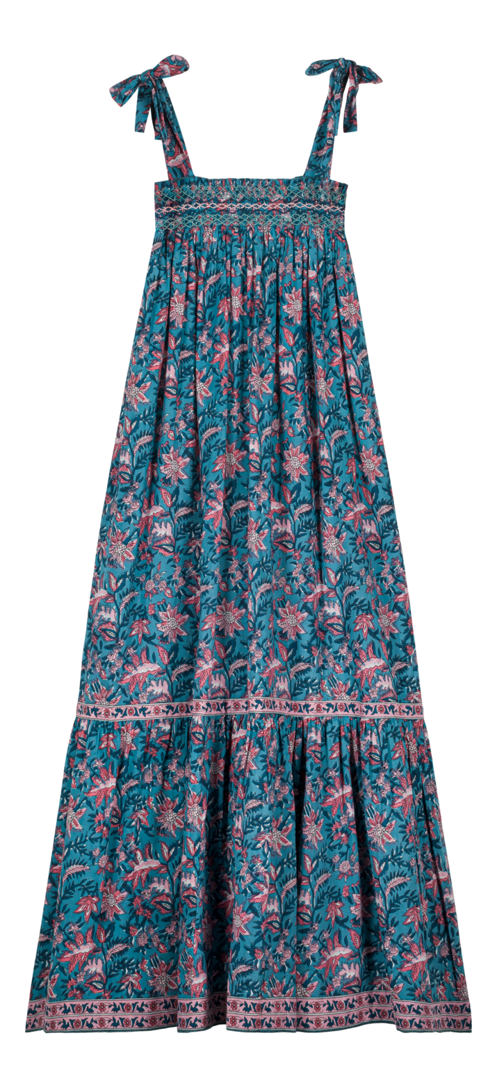 The women's maxi dress Marcelina in Teal Garden of Eden is long, loose-fit, and perfect for summer. This maxi dress is stylish, breathable and lightweight with a handmade contrasted smocking breastplate. This long dress is must have for capsule wardrobe. Maxi dress is part of Mini Me fashion for son and Mommy matching.