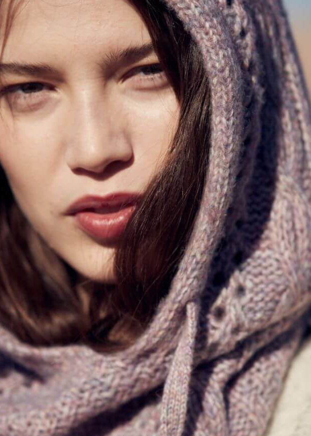 Woman wearing mauve merino wool hood by Louise Misha - sustainable winter accessory