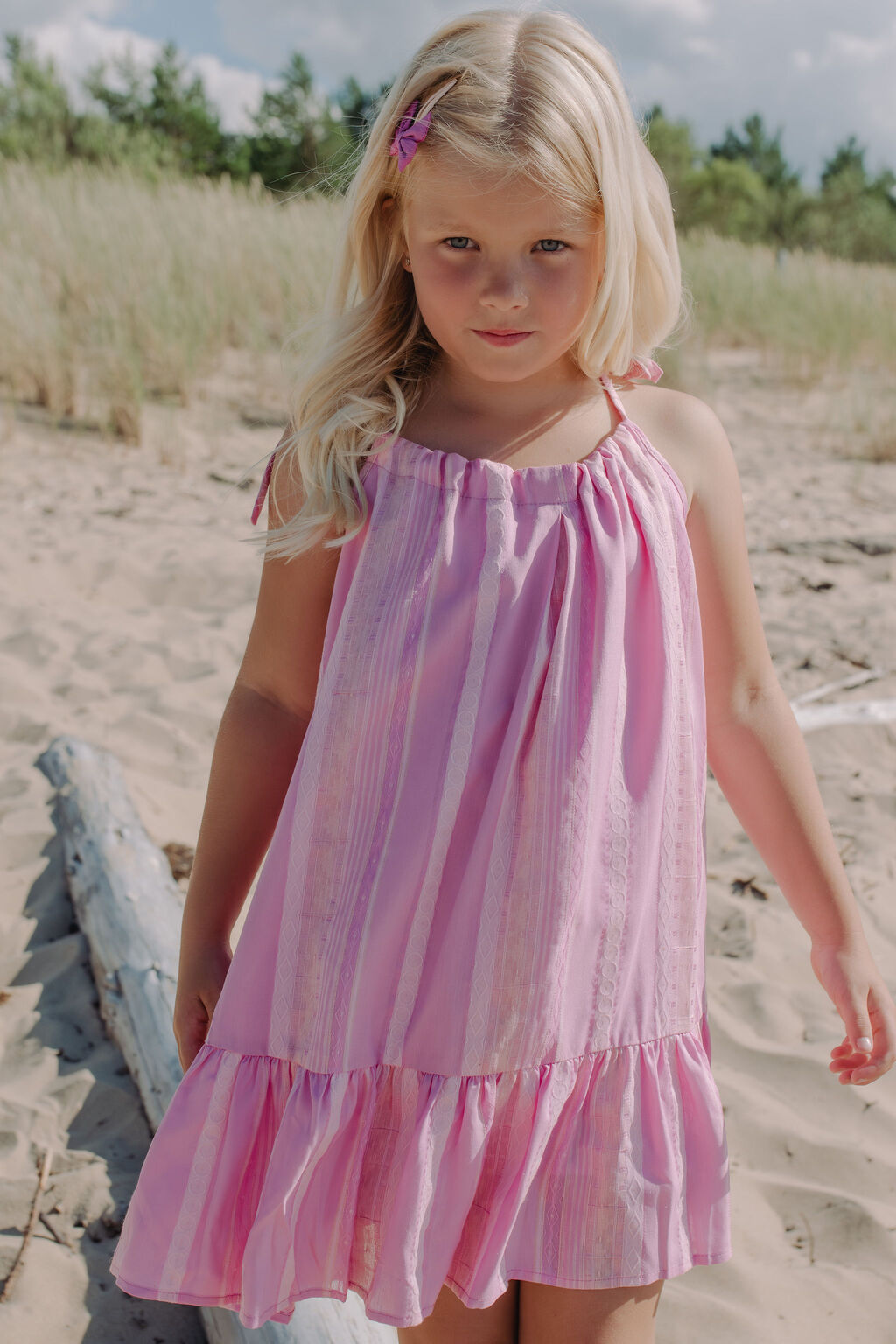 Flowy pink Lilly dress for girls that is comfortable summer playwear and a perfect holiday dress.