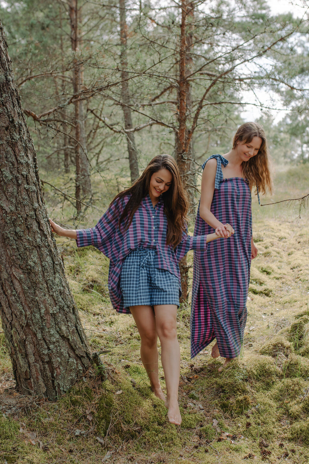 Friends wearing matching bright blue check shorts that are coordinated, sustainable, and stylish.